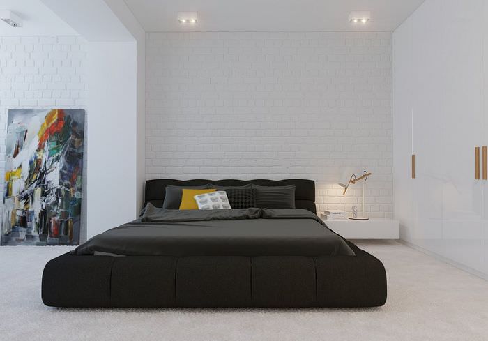 Черная кровать в спальне стиля минимализма